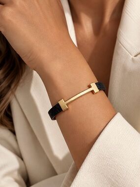 Sculptural Gold and Black Leather Bracelet Elegant Minimalist Luxury Jewelry